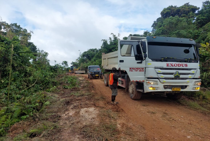Dump truck moving material on an ETDL work site